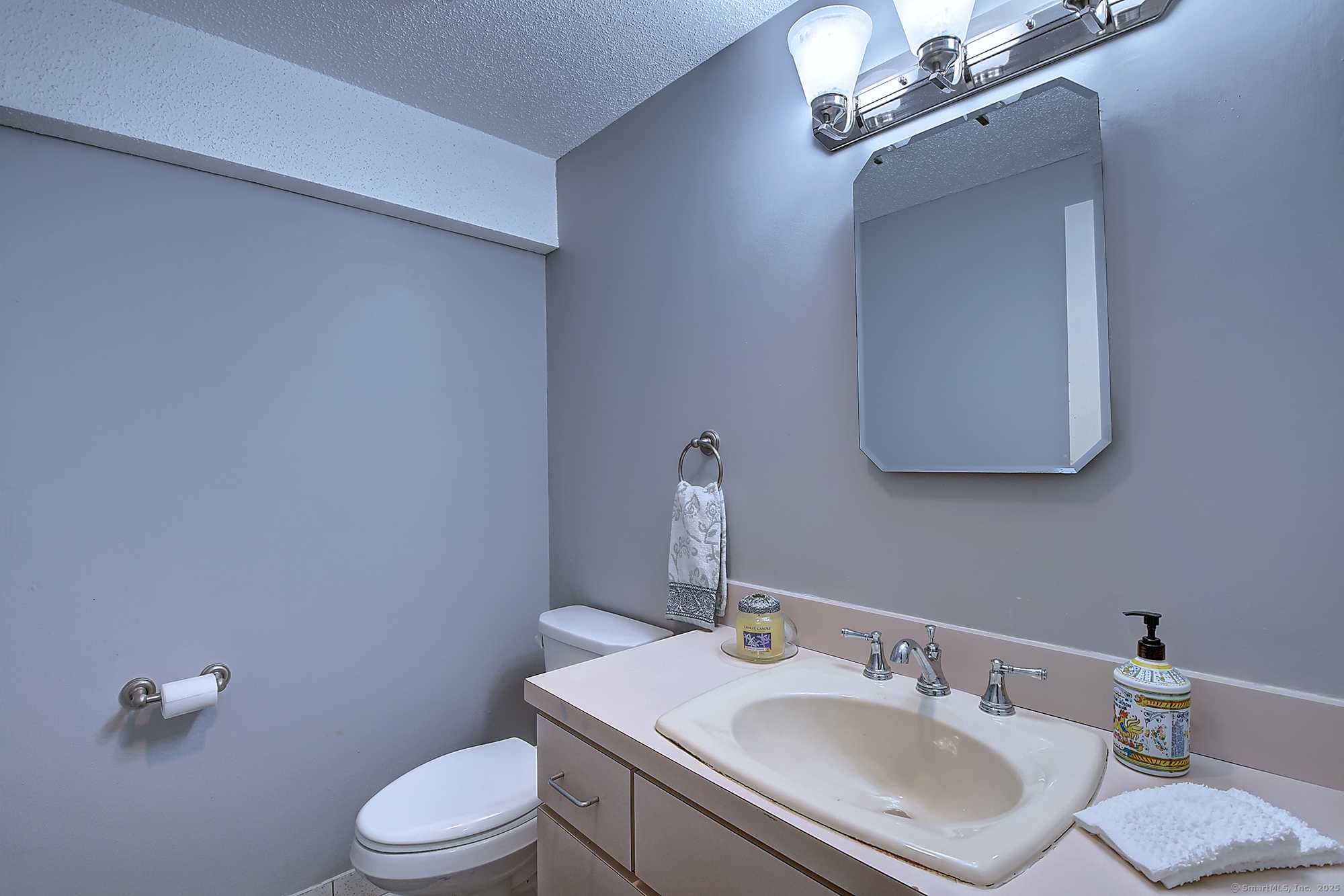 615 Ridge Road Wethersfield, CT 06109 - Photo 21 of 40 a bathroom with a sink toilet and mirror