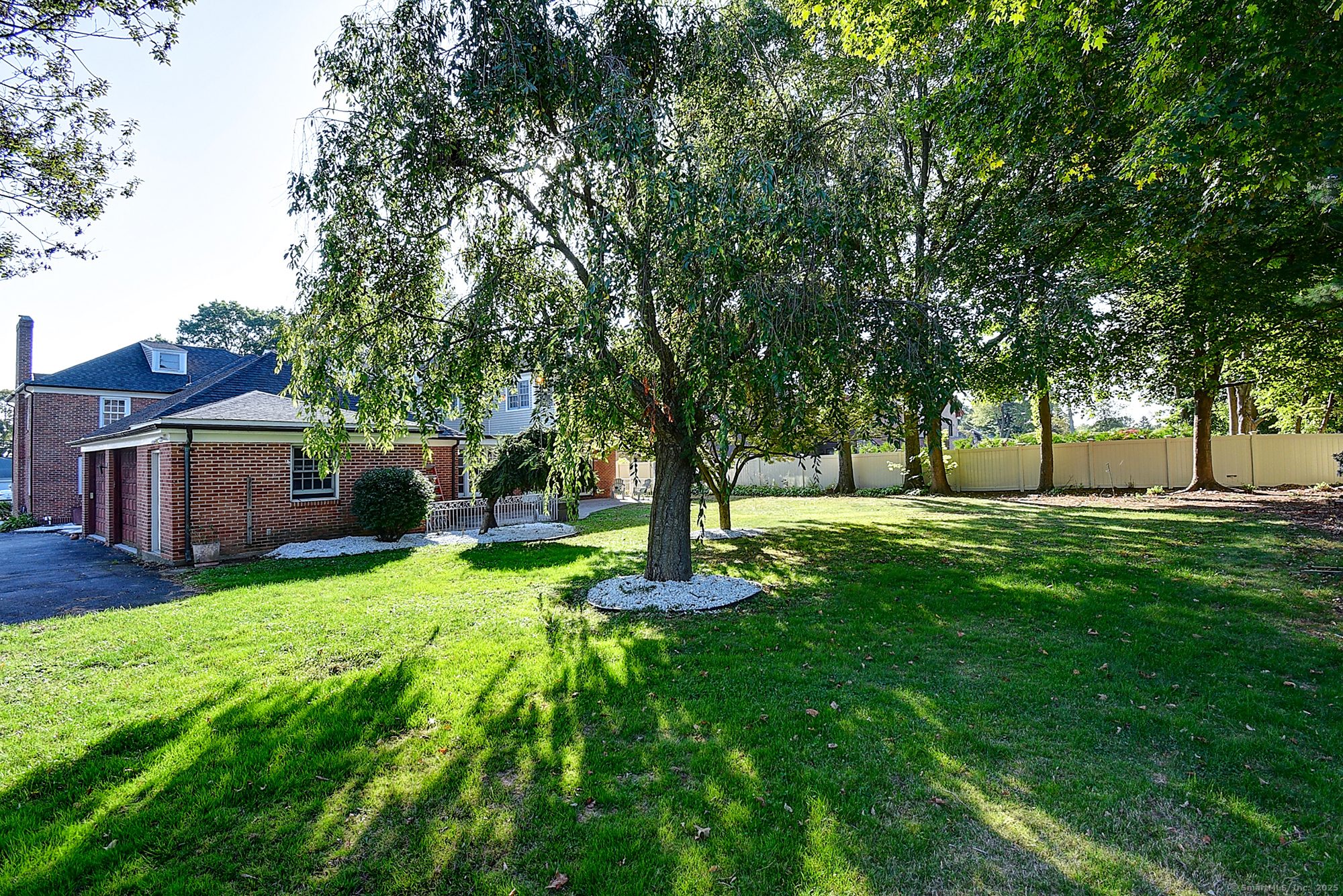 615 Ridge Road Wethersfield, CT 06109 - Photo 24 of 40 a garden view with a seating space
