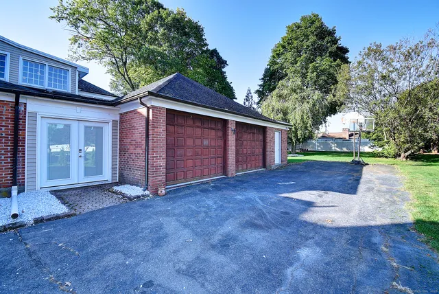 a bedroom with a bed and flat screen tv