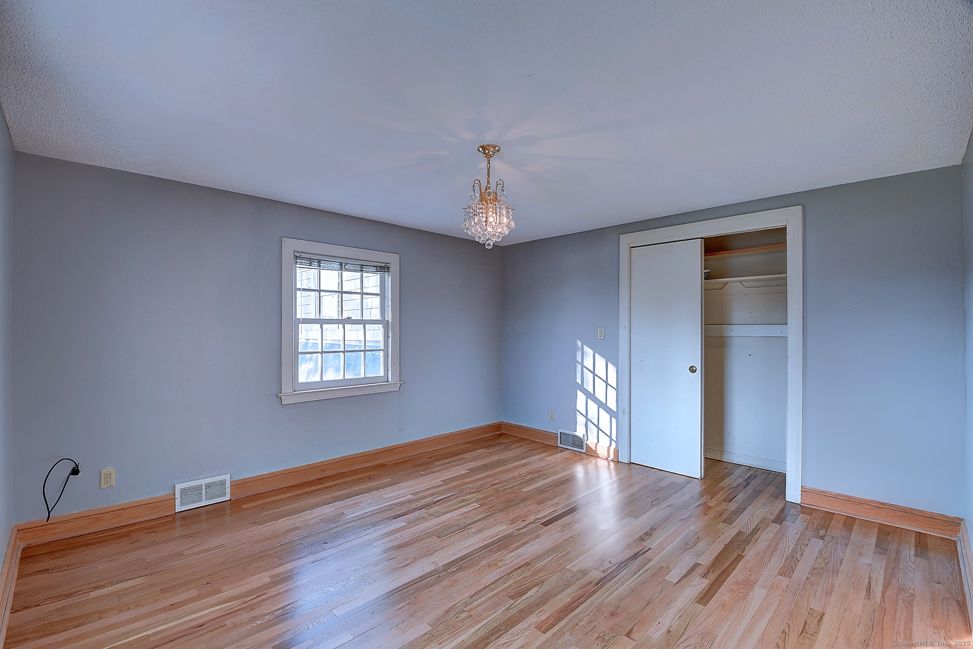 615 Ridge Road Wethersfield, CT 06109 - Photo 36 of 40 a view of empty room with wooden floor and fan