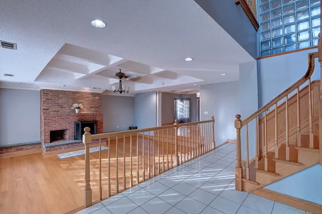 a view of a hallway with stairs