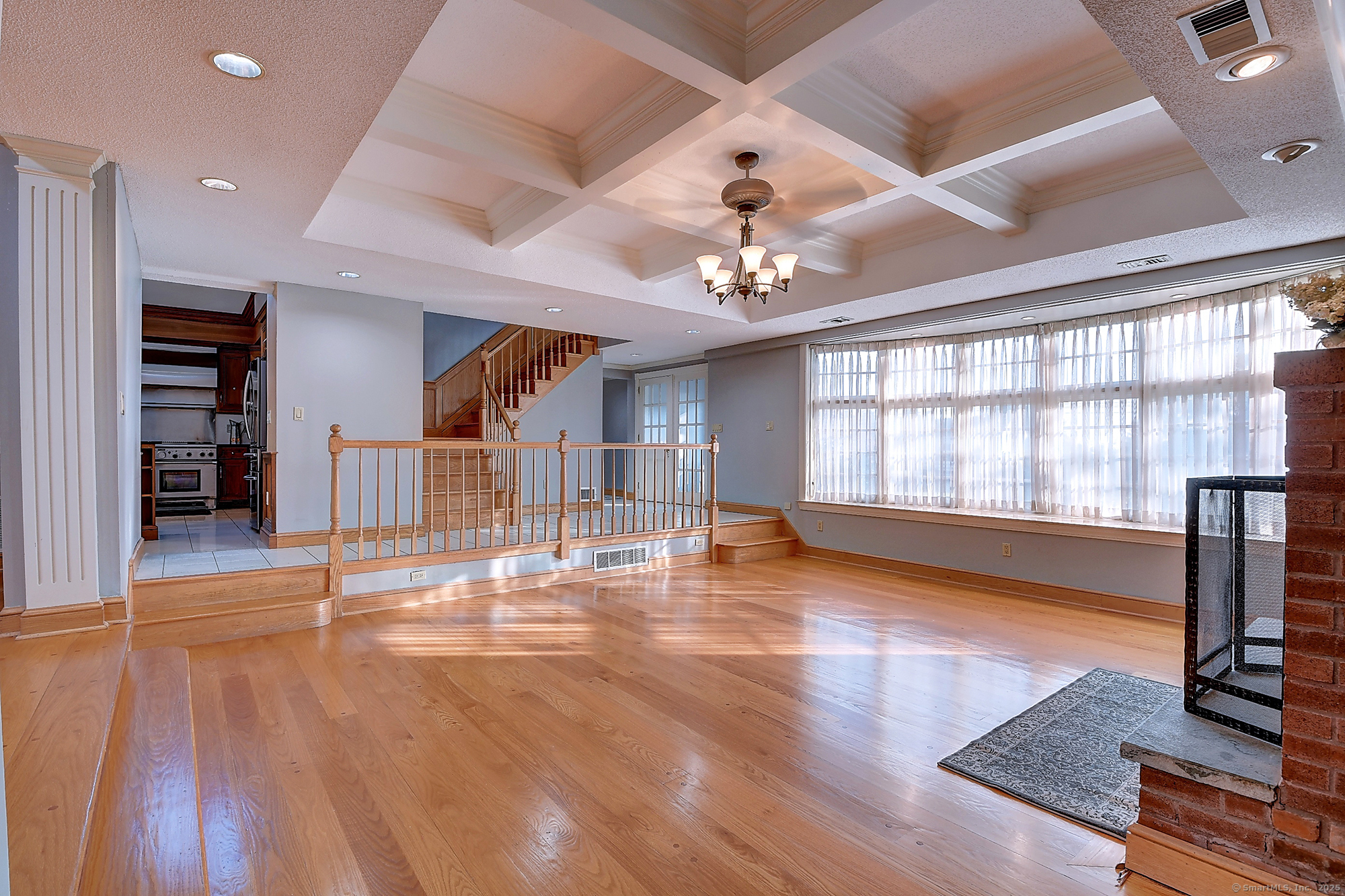 615 Ridge Road Wethersfield, CT 06109 - Photo 7 of 40 a view of an empty room with window and wooden floor