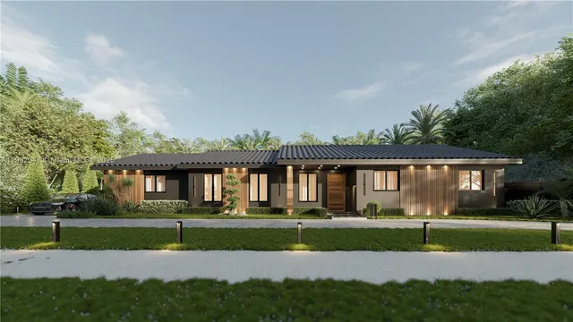 a front view of house with yard and green space