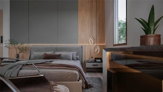 a bedroom with a bed and a potted plant