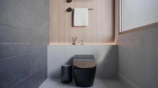 a bathroom with a sink a toilet and mirror
