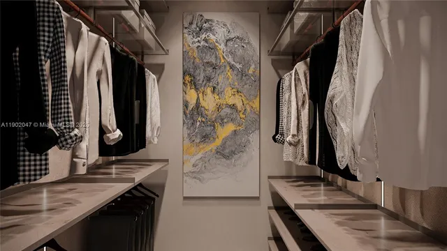 a view of walk in closet with clothes and shoes