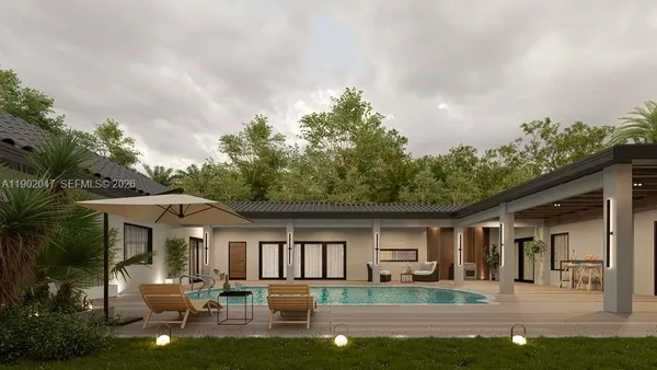 a house view with swimming pool and garden space