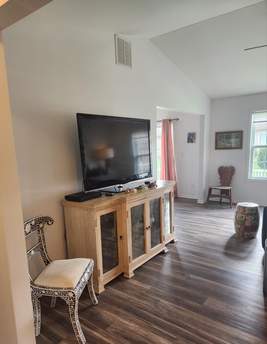 838 Daisy Circle Northeast De Motte, IN 46310 - Photo 12 of 41 a living room with furniture and a flat screen tv