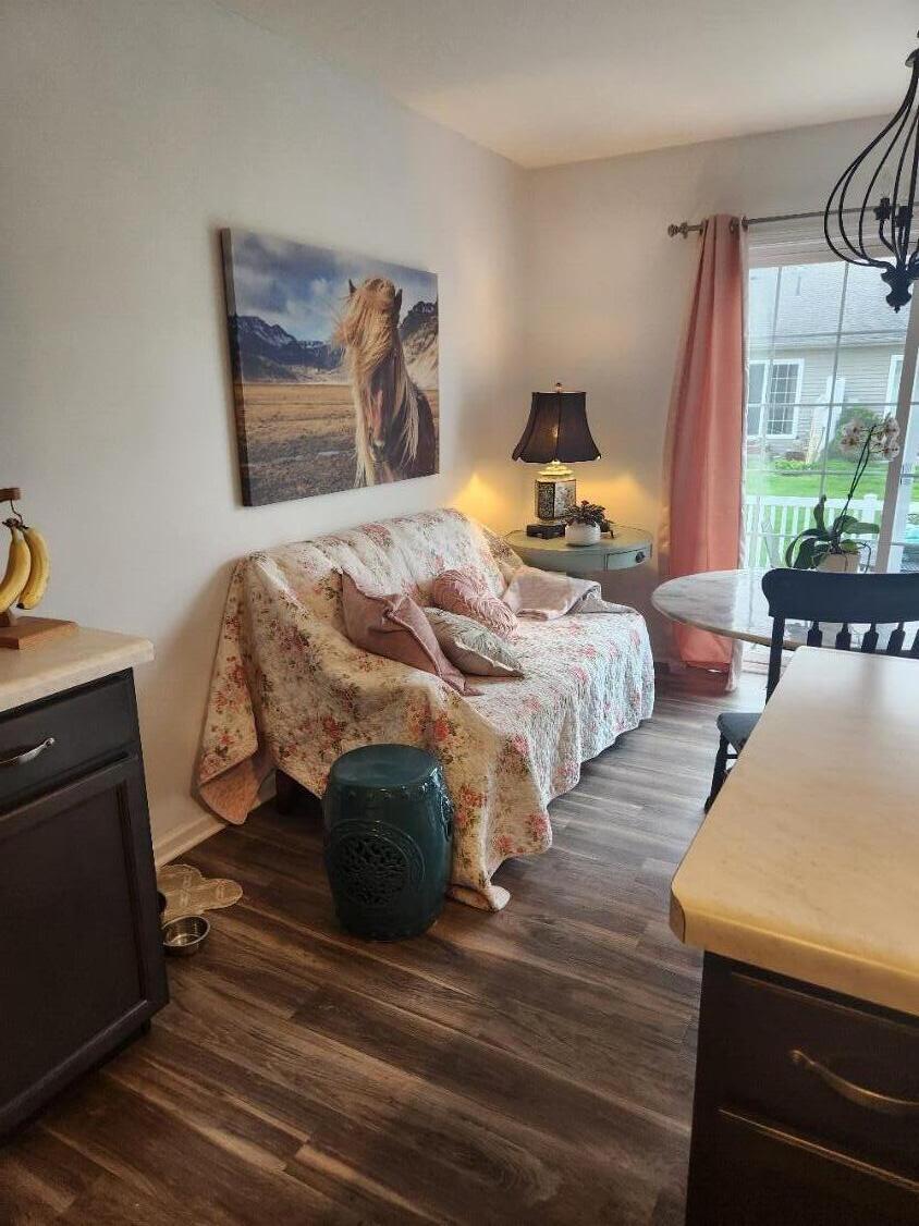 838 Daisy Circle Northeast De Motte, IN 46310 - Photo 13 of 41 a bedroom with a bed and wooden floor