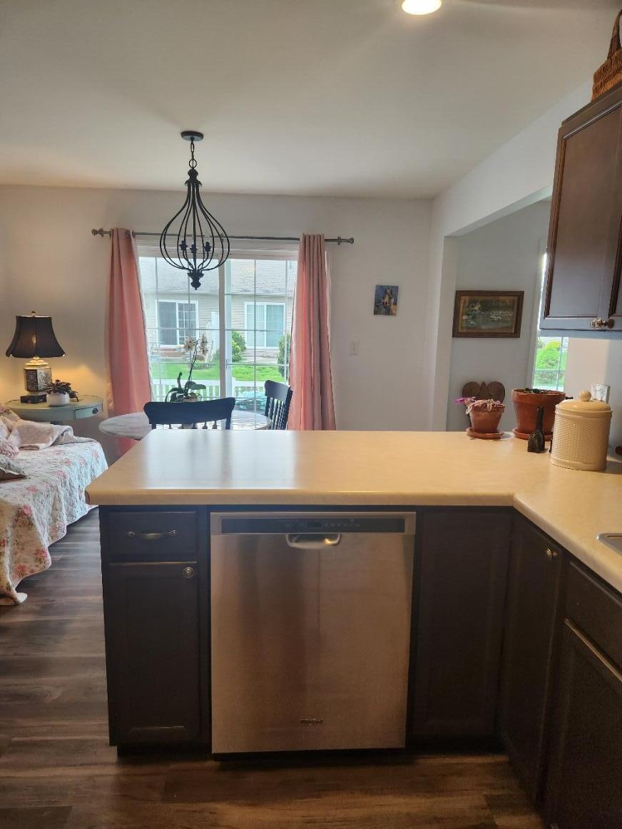 838 Daisy Circle Northeast De Motte, IN 46310 - Photo 15 of 41 a view of a kitchen counter space a sink wooden floor and living room view