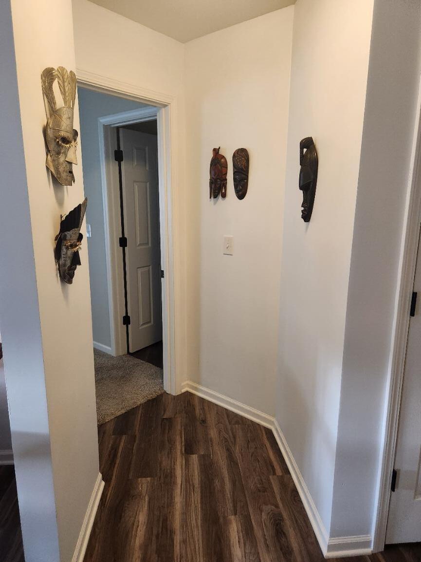 838 Daisy Circle Northeast De Motte, IN 46310 - Photo 21 of 41 a view of a hallway with wooden floor and closet