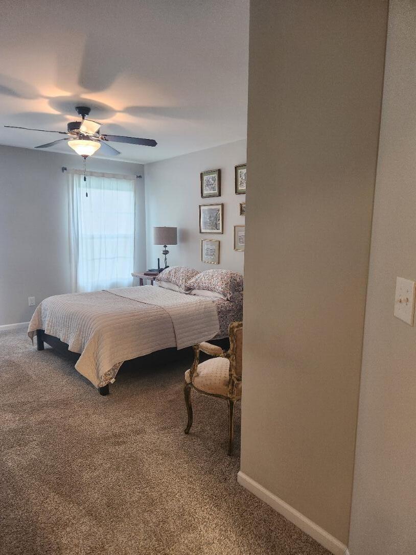 838 Daisy Circle Northeast De Motte, IN 46310 - Photo 22 of 41 a bedroom with a bed couch and window