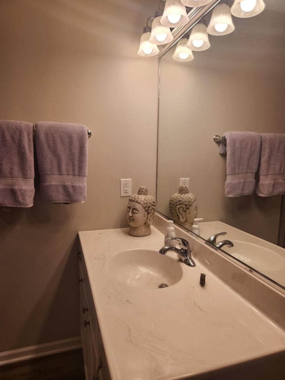 838 Daisy Circle Northeast De Motte, IN 46310 - Photo 27 of 41 a bathroom with a sink and a mirror