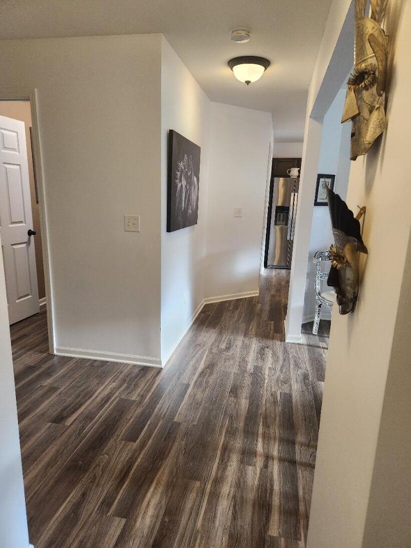 838 Daisy Circle Northeast De Motte, IN 46310 - Photo 4 of 41 a view of hallway with wooden floor and stairs