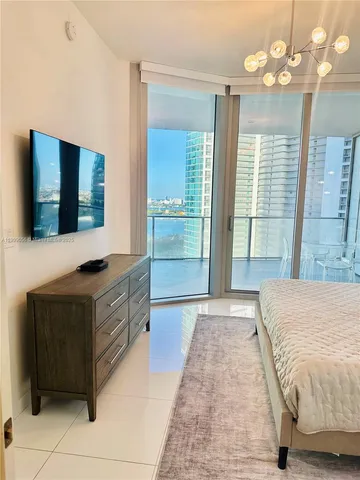 a spacious bathroom with a double vanity sink a mirror and a shower