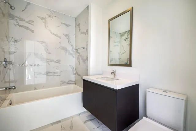 a bathroom with a sink and a bathtub