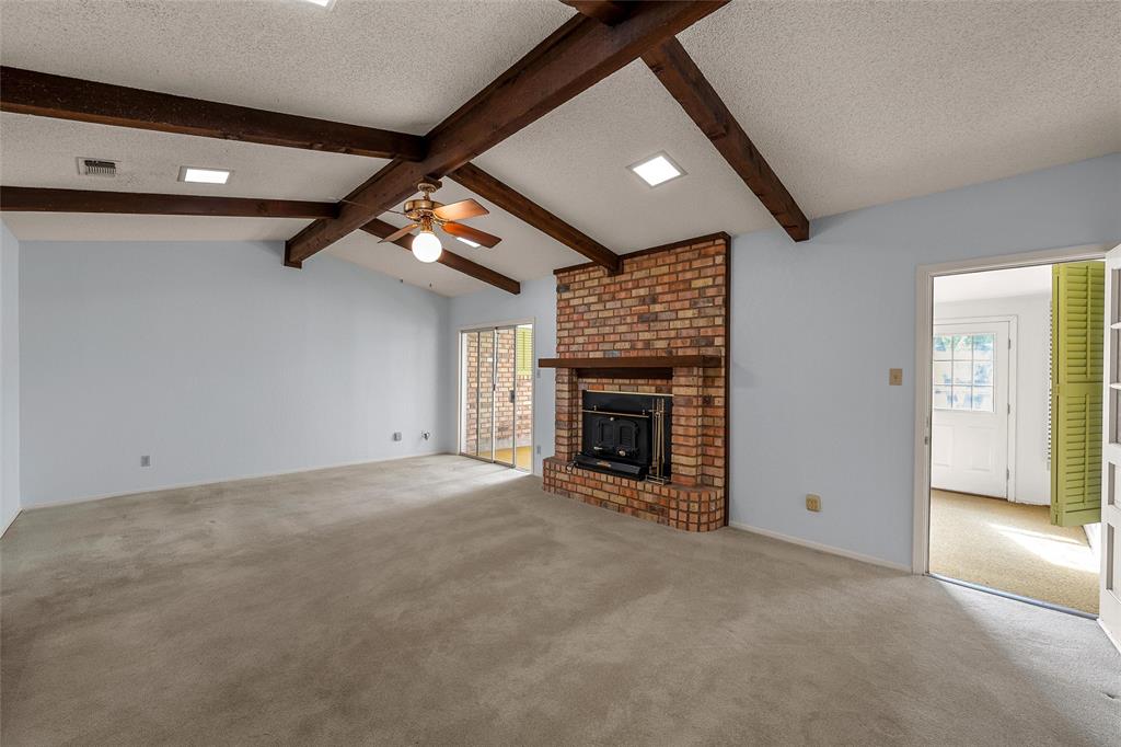 219 Opal Street Hewitt, TX 76643 - Photo 5 of 28 a view of an empty room with a fireplace
