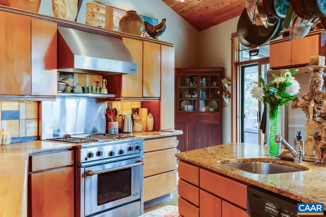 a view of a dining area with furniture and a potted plant