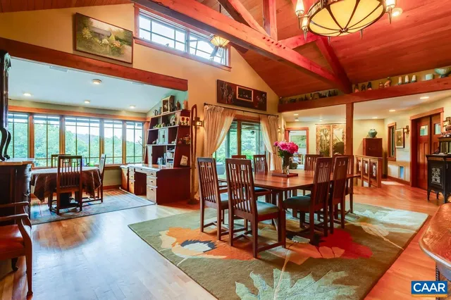 a living room with furniture a flat screen tv and next to a window