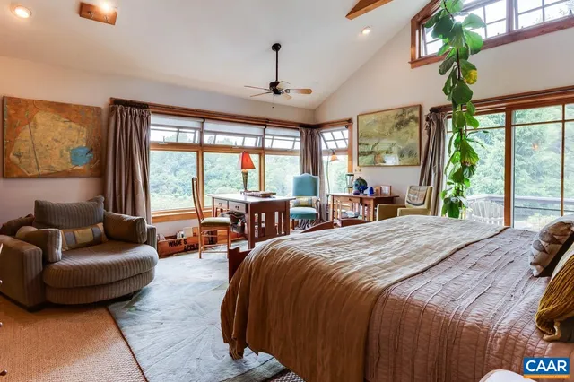 a bedroom with furniture and a window