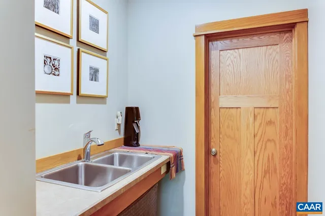 a view of front door with a door and a window