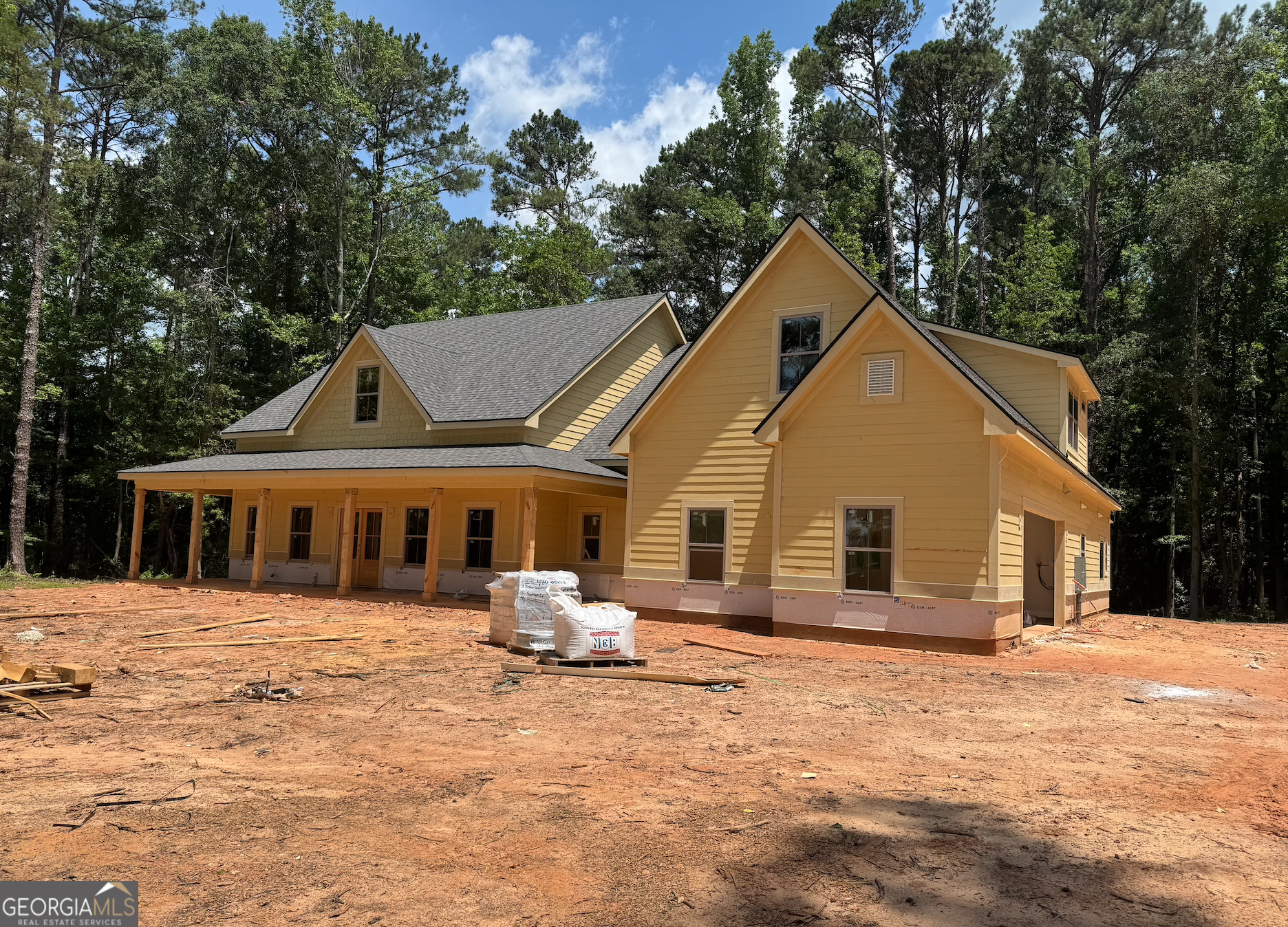164 South Henderson Mill Road Mansfield, GA 30055 - Photo 2 of 11 a front view of a house with a yard covered in snow