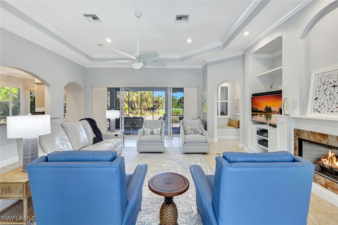 2450 Wulfert Road Sanibel, FL 33957 - Photo 14 of 44 a living room with fireplace furniture and a flat screen tv