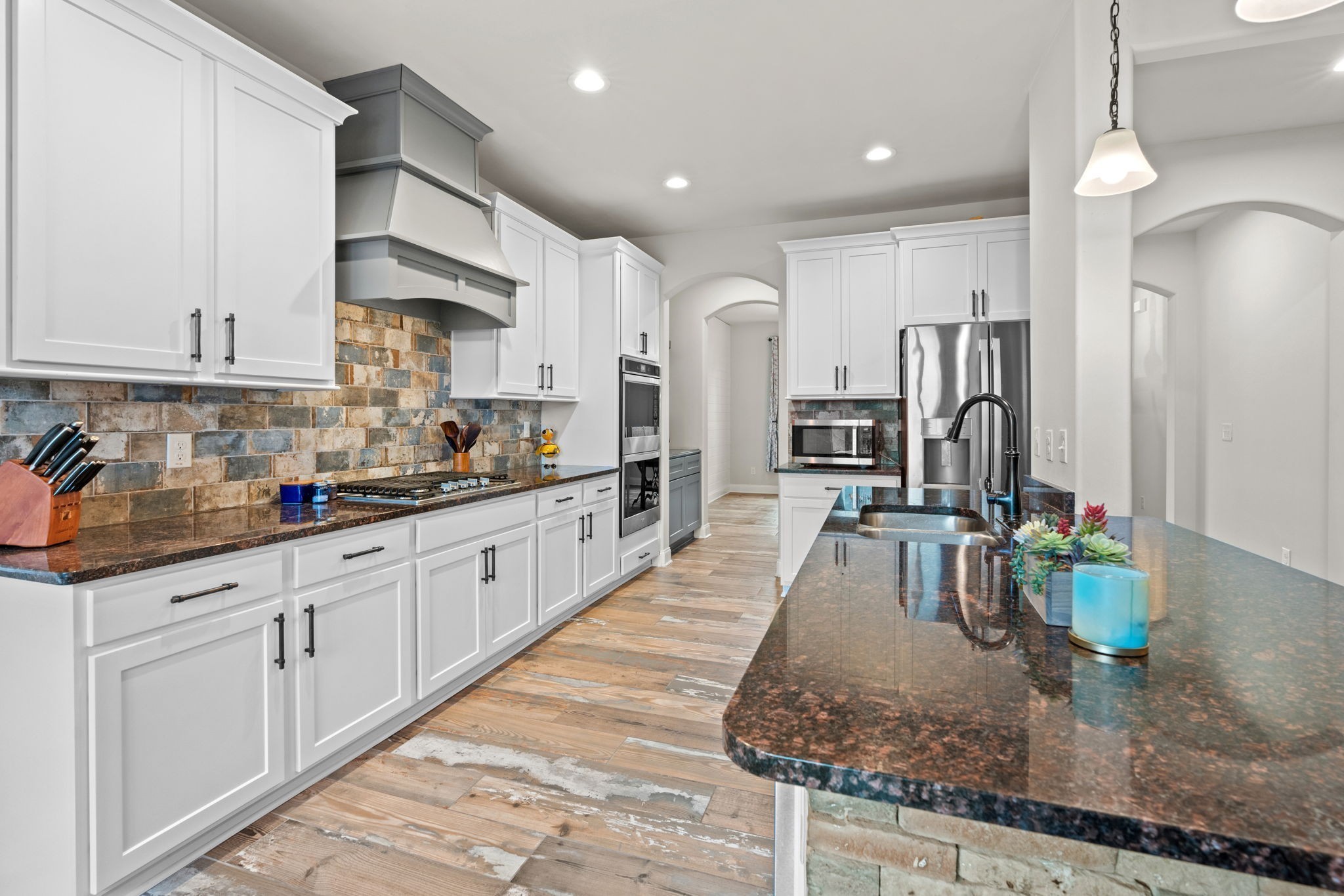 2957 Stewart Campbell Pointe Spring Hill, TN 37174 - Photo 17 of 53 a large kitchen with stainless steel appliances granite countertop a large counter top and a sink