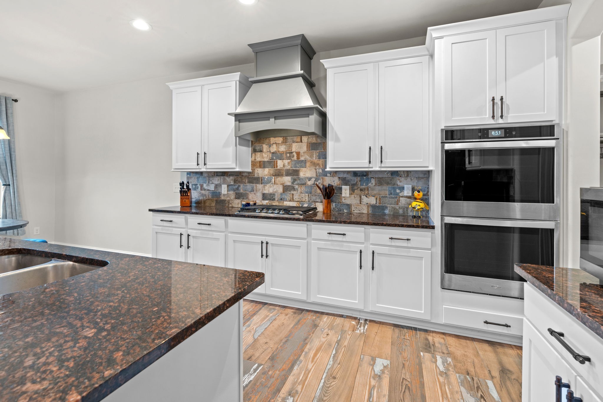 2957 Stewart Campbell Pointe Spring Hill, TN 37174 - Photo 18 of 53 a kitchen with stainless steel appliances granite countertop a sink stove and microwave