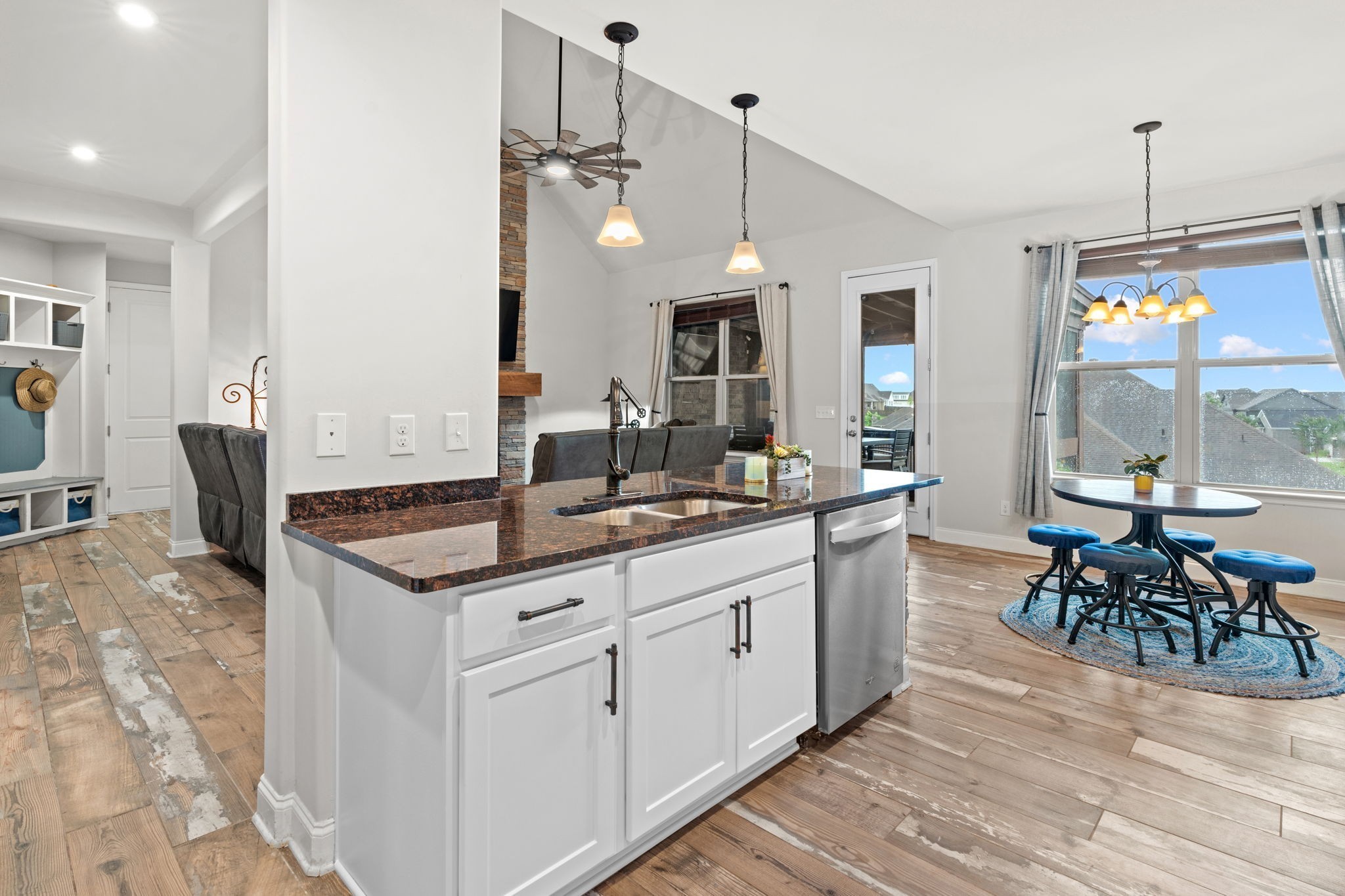 2957 Stewart Campbell Pointe Spring Hill, TN 37174 - Photo 19 of 53 a kitchen with center island table and chairs