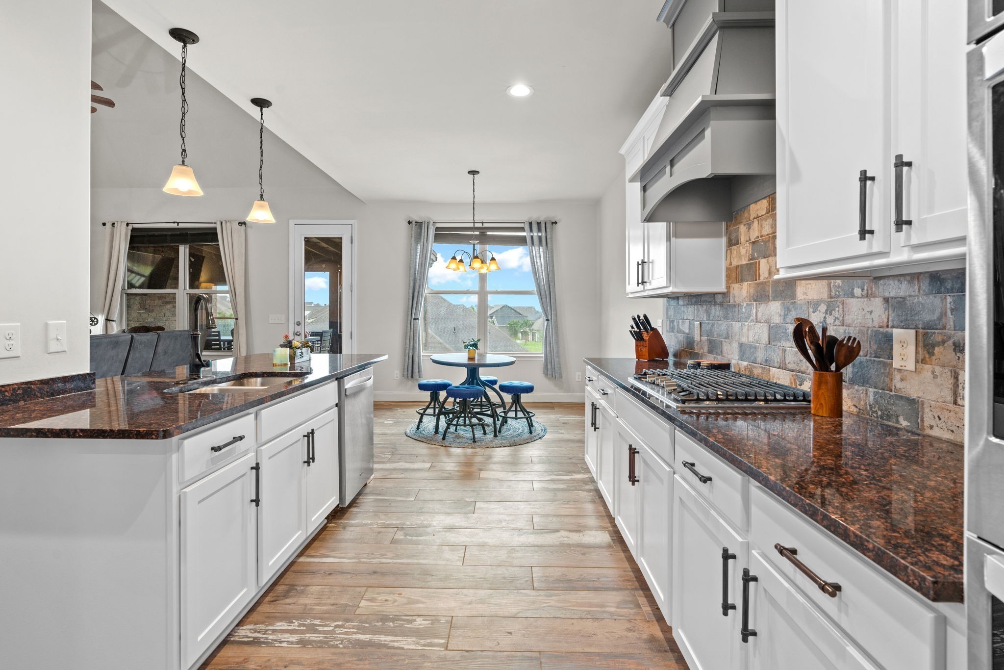 2957 Stewart Campbell Pointe Spring Hill, TN 37174 - Photo 20 of 53 a large kitchen with stainless steel appliances granite countertop lots of counter space and a sink