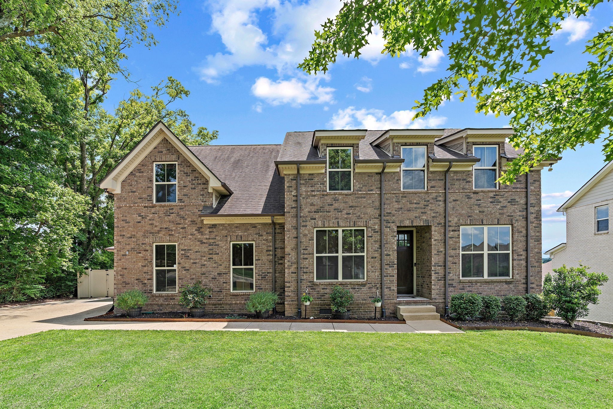 2957 Stewart Campbell Pointe Spring Hill, TN 37174 - Photo 2 of 53 a front view of a house with a yard and garage