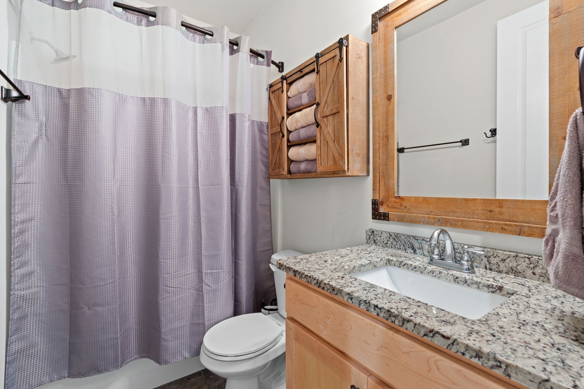 2957 Stewart Campbell Pointe Spring Hill, TN 37174 - Photo 29 of 53 a bathroom with a granite countertop sink and a mirror