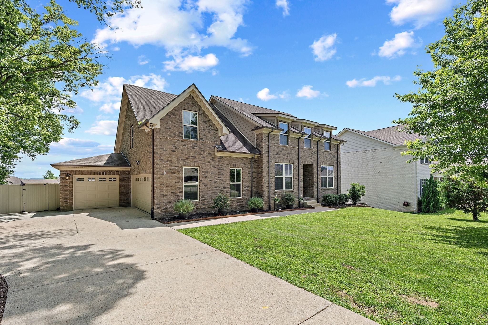 2957 Stewart Campbell Pointe Spring Hill, TN 37174 - Photo 3 of 53 a front view of a house with a yard and garage