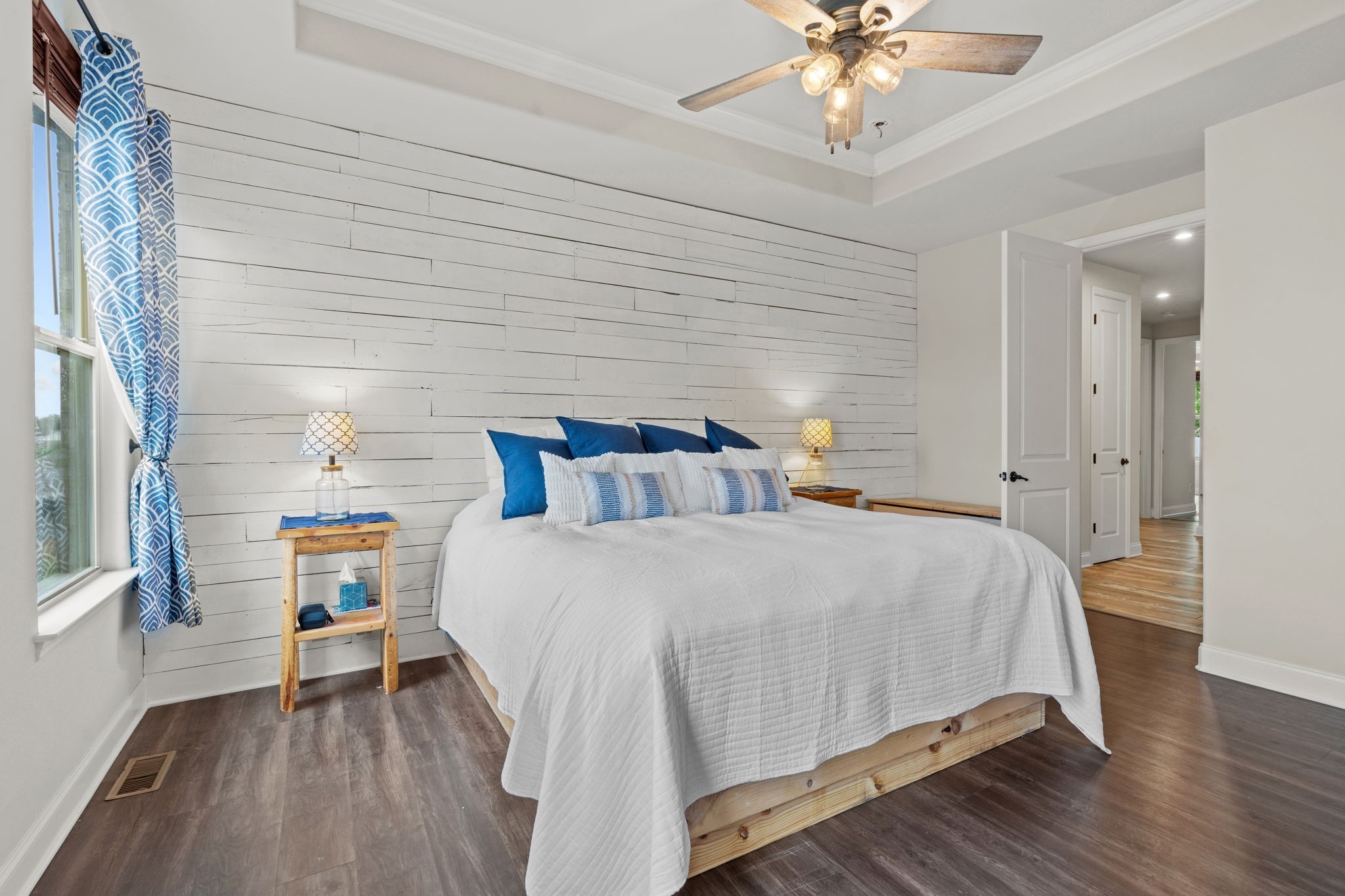 2957 Stewart Campbell Pointe Spring Hill, TN 37174 - Photo 32 of 53 a bedroom with a bed and a chandelier