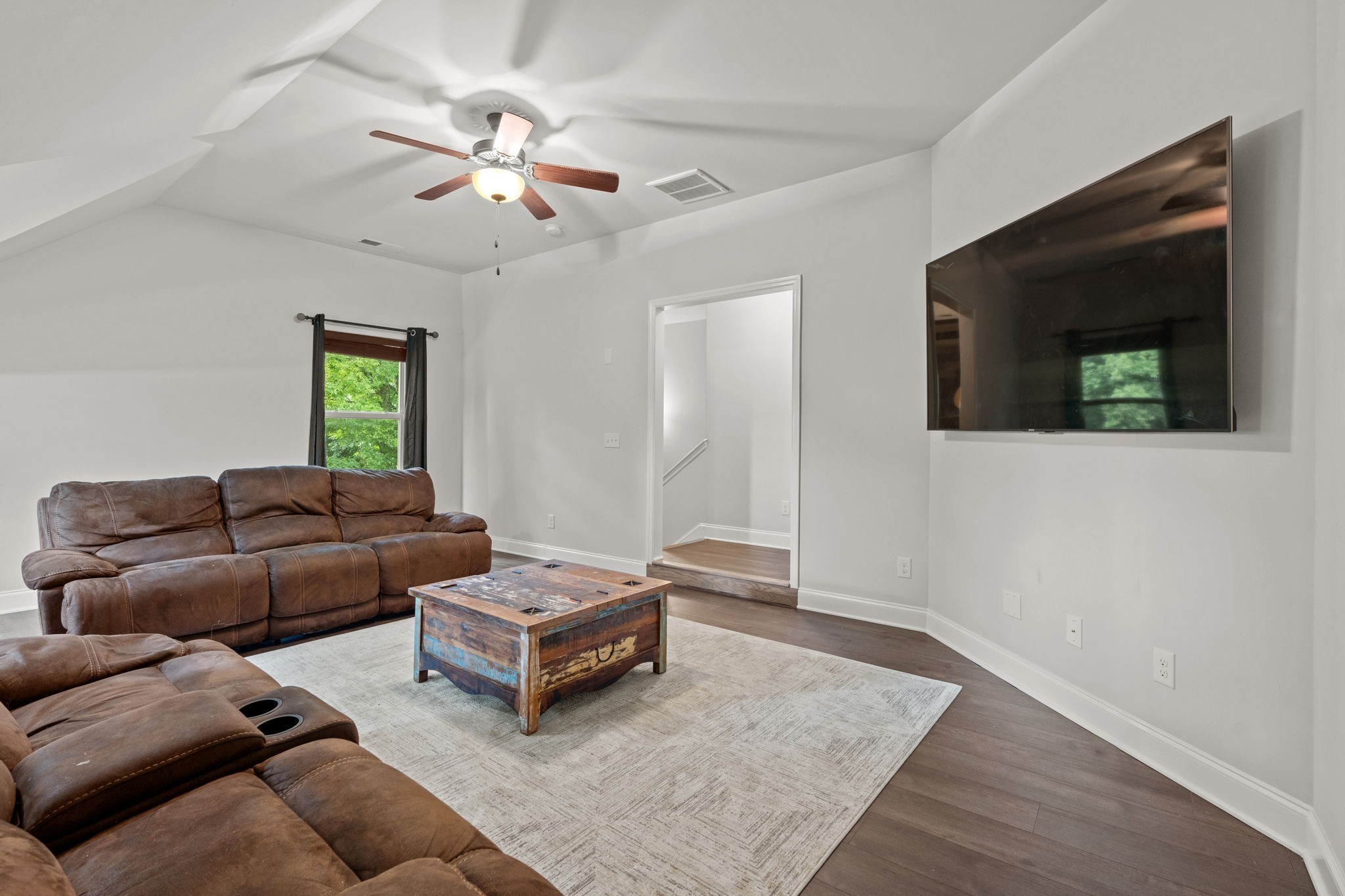 2957 Stewart Campbell Pointe Spring Hill, TN 37174 - Photo 40 of 53 a living room with furniture and a flat screen tv