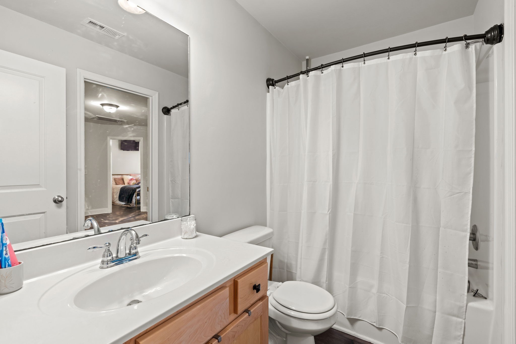 2957 Stewart Campbell Pointe Spring Hill, TN 37174 - Photo 41 of 53 a bathroom with a sink a toilet and shower curtain