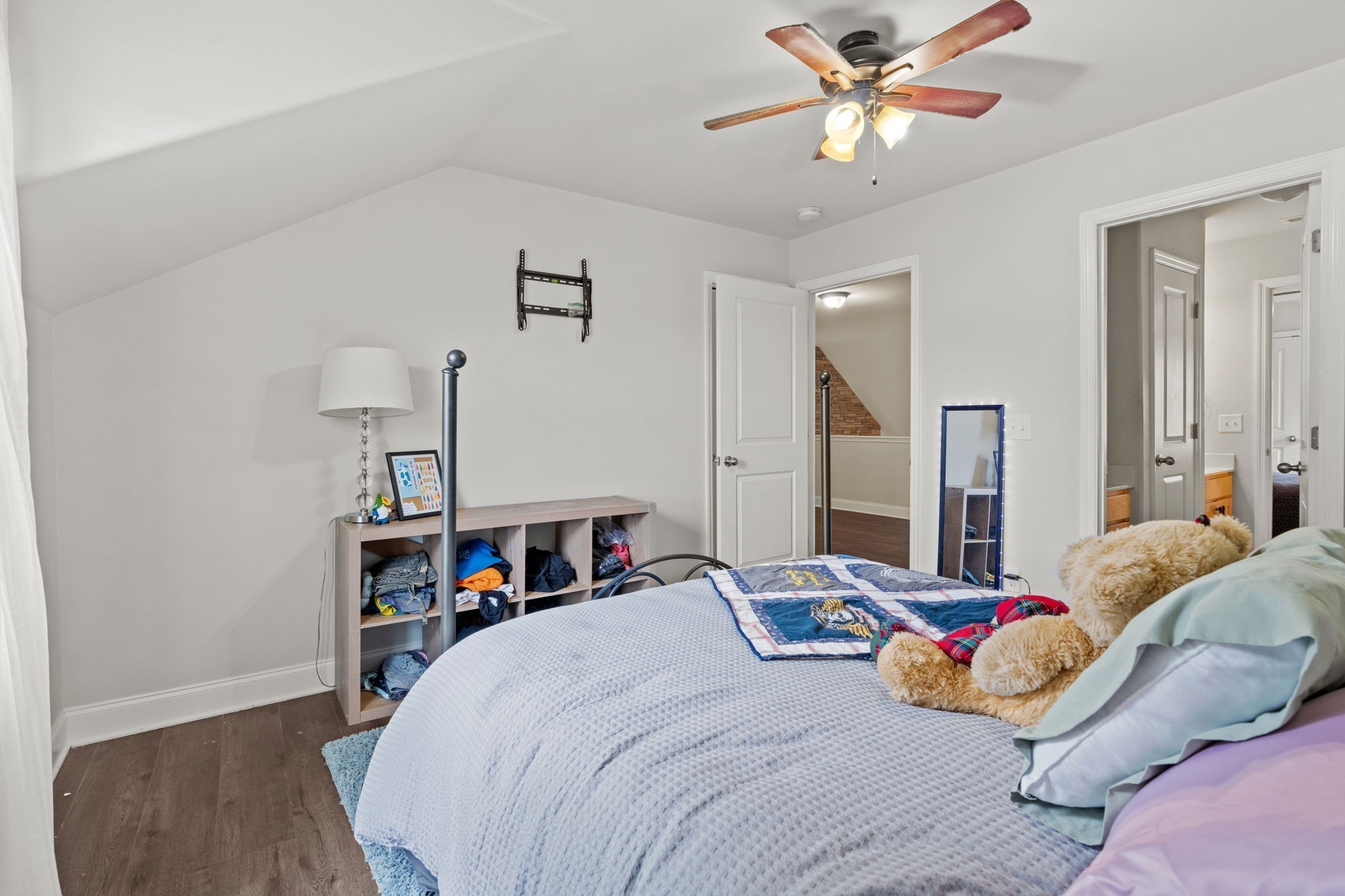 2957 Stewart Campbell Pointe Spring Hill, TN 37174 - Photo 45 of 53 a bedroom with a bed and a chandelier