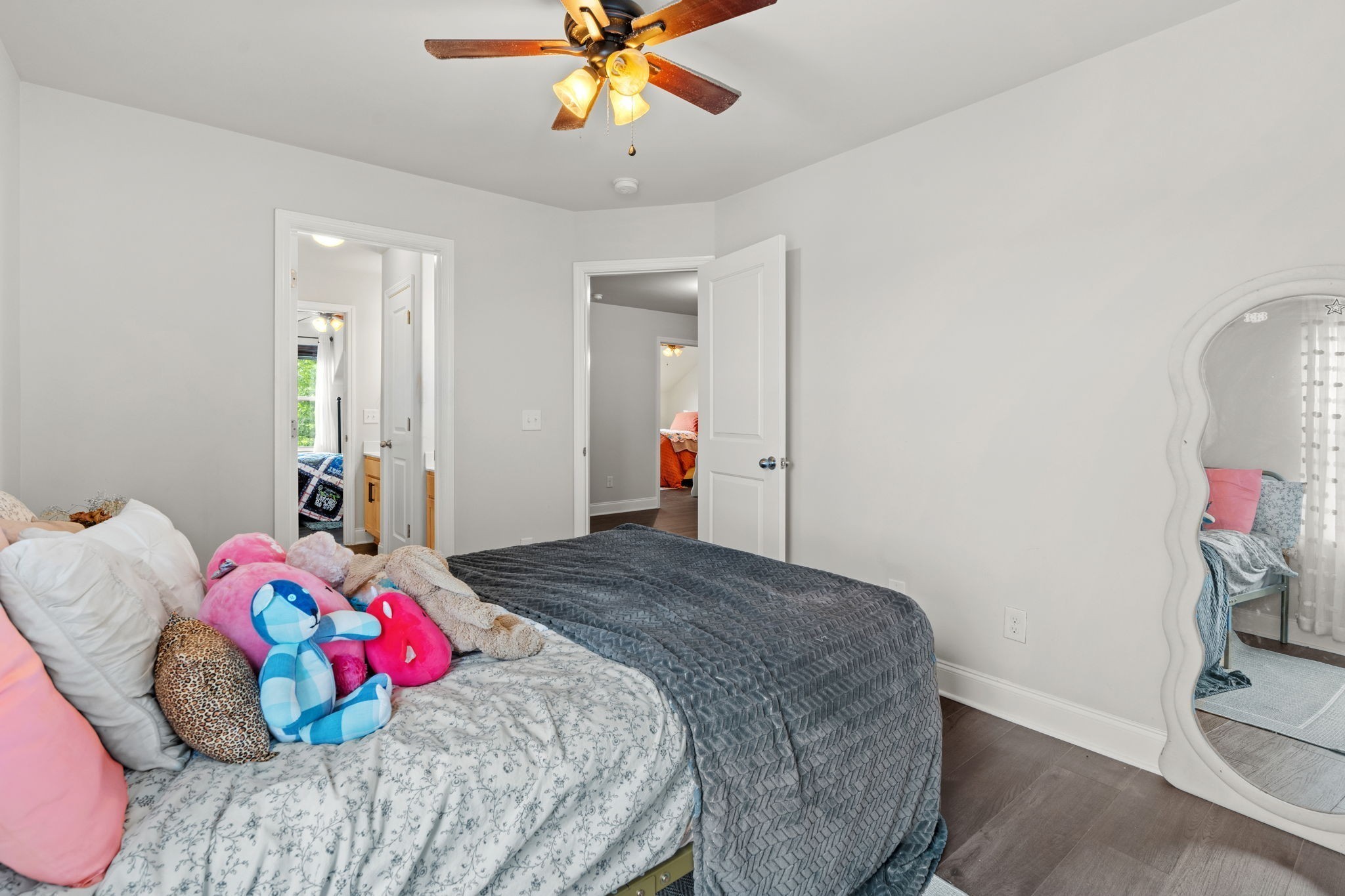 2957 Stewart Campbell Pointe Spring Hill, TN 37174 - Photo 49 of 53 a bedroom with a bed and a chandelier