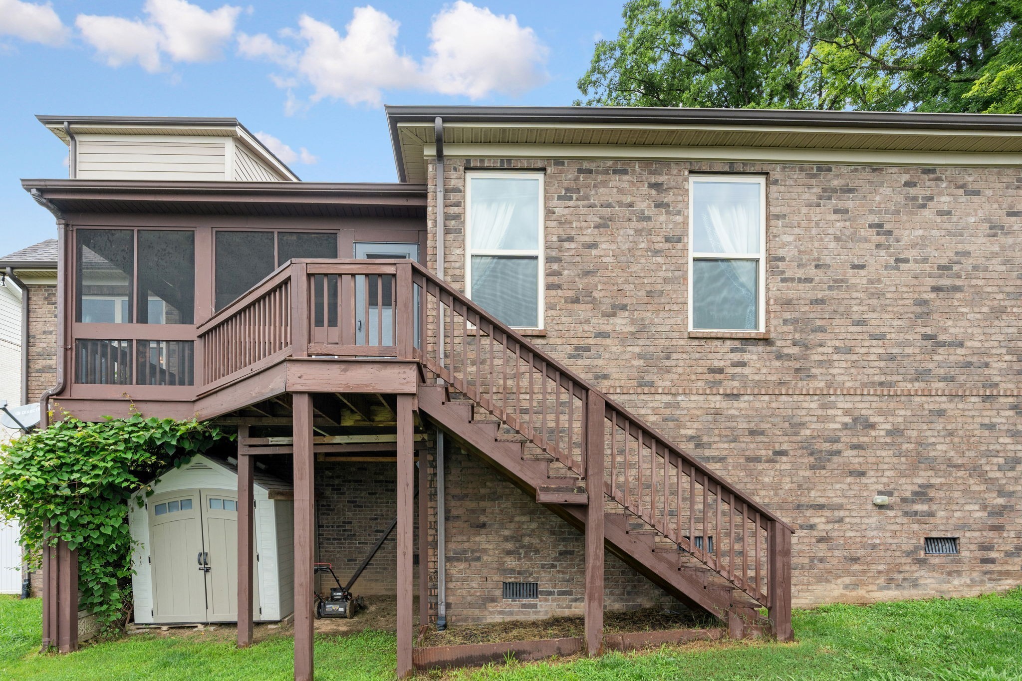 2957 Stewart Campbell Pointe Spring Hill, TN 37174 - Photo 51 of 53 a view of a house with brick walls and a small yard