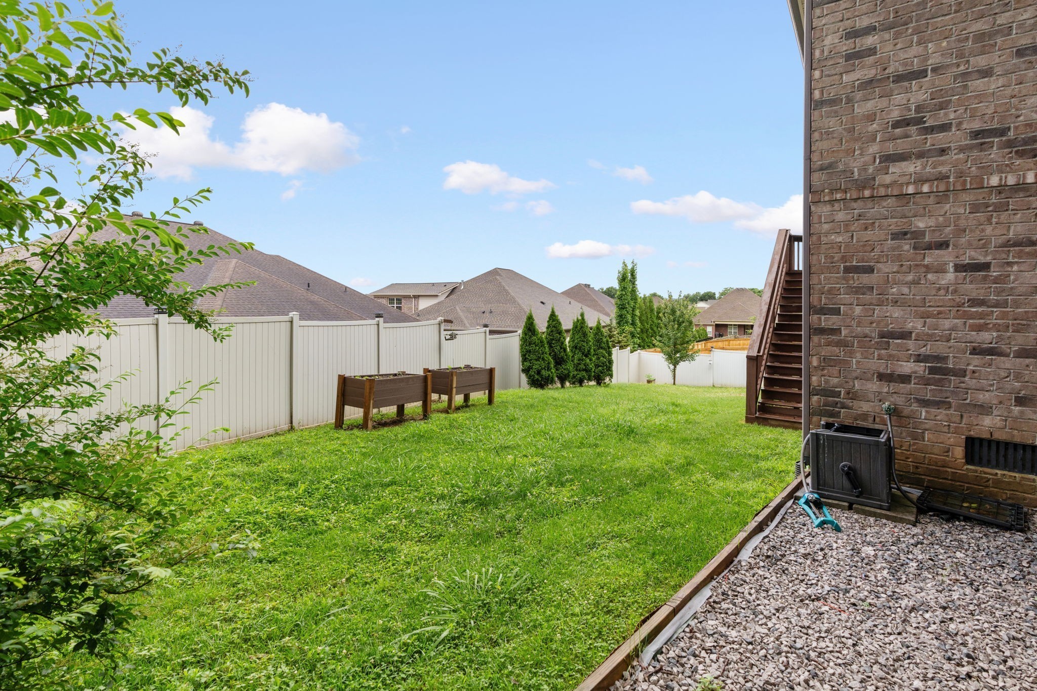 2957 Stewart Campbell Pointe Spring Hill, TN 37174 - Photo 52 of 53 a view of a back yard of the house