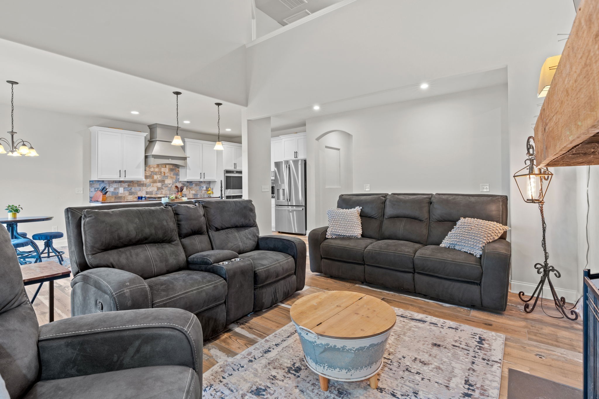 2957 Stewart Campbell Pointe Spring Hill, TN 37174 - Photo 10 of 53 a living room with furniture a rug and a chandelier