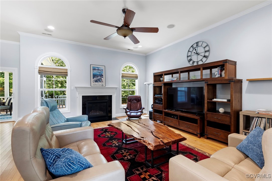 14619 Forest Row Trail Midlothian, VA 23112 - Photo 11 of 43 a living room with furniture a flat screen tv and a fireplace