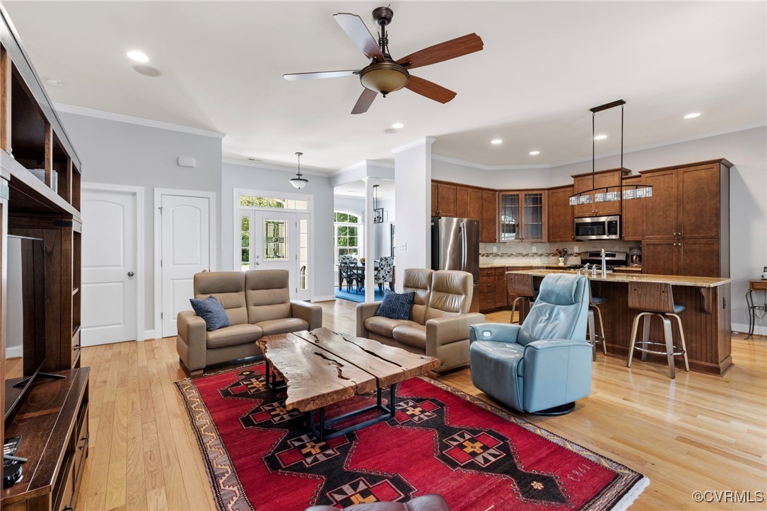 14619 Forest Row Trail Midlothian, VA 23112 - Photo 13 of 43 a living room with furniture kitchen view and a flat screen tv