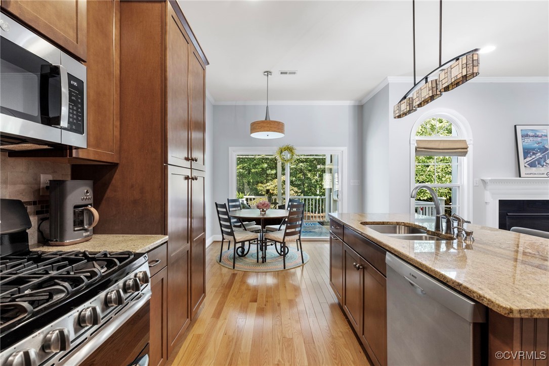 14619 Forest Row Trail Midlothian, VA 23112 - Photo 14 of 43 a kitchen with stove a sink and chairs