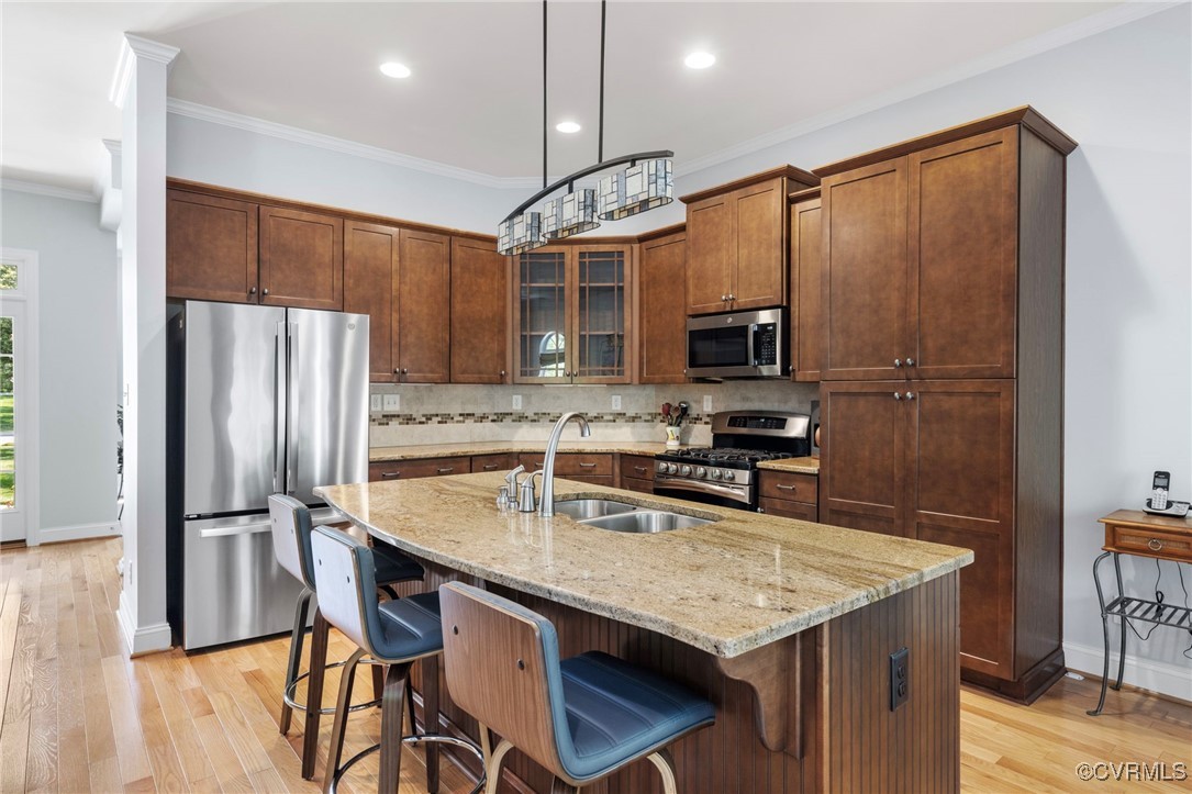 14619 Forest Row Trail Midlothian, VA 23112 - Photo 15 of 43 a kitchen with granite countertop a refrigerator and a stove top oven