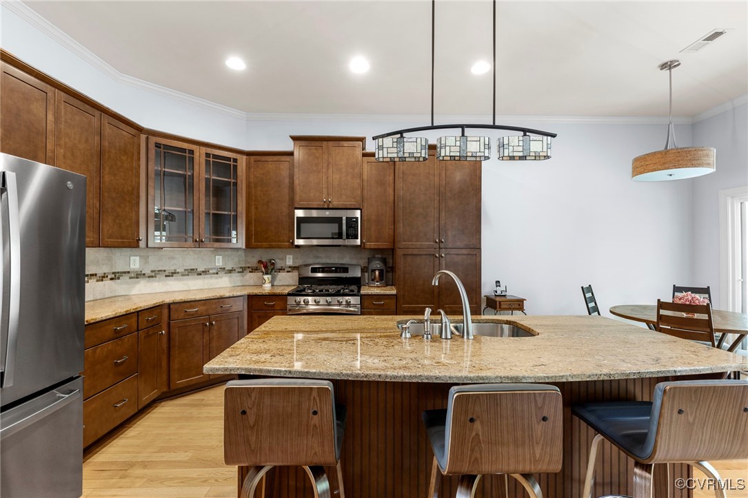 14619 Forest Row Trail Midlothian, VA 23112 - Photo 16 of 43 a kitchen with stainless steel appliances granite countertop a sink a stove and refrigerator