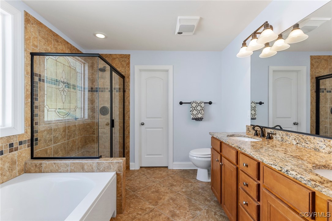 14619 Forest Row Trail Midlothian, VA 23112 - Photo 20 of 43 a spacious bathroom with a granite countertop sink a toilet a mirror and shower