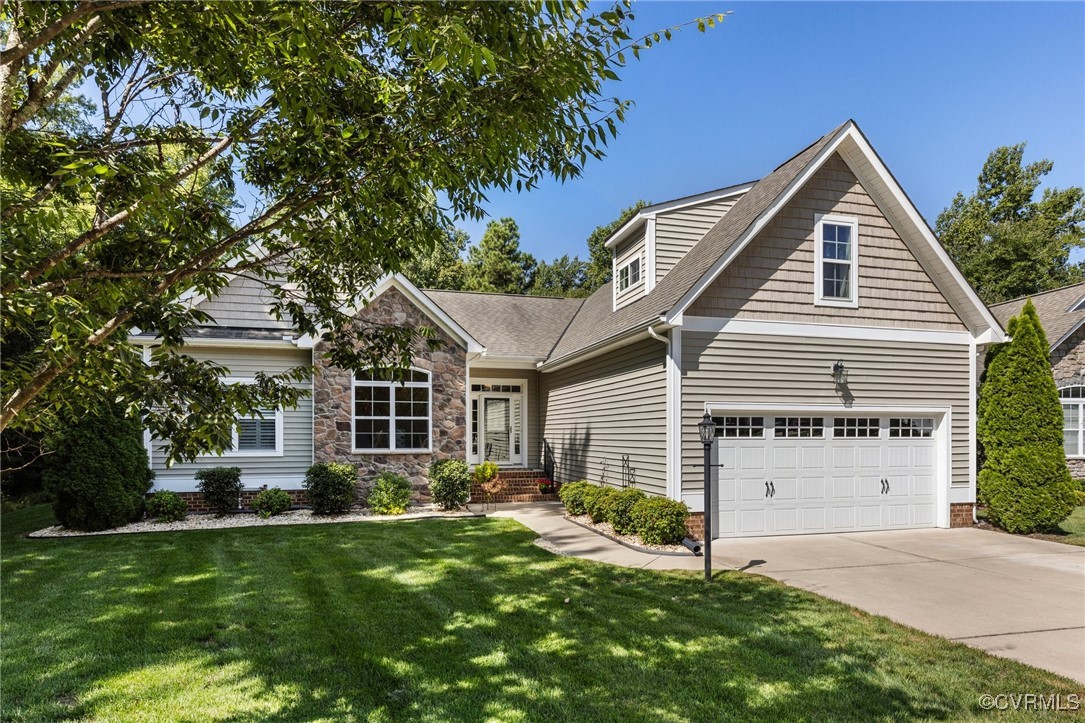 14619 Forest Row Trail Midlothian, VA 23112 - Photo 2 of 43 a front view of a house with a yard and garage