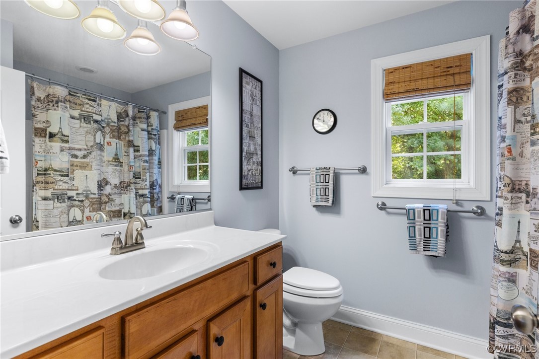 14619 Forest Row Trail Midlothian, VA 23112 - Photo 25 of 43 a bathroom with a sink a toilet and shower